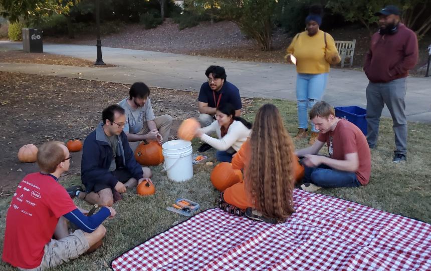 Students carving pumpkins